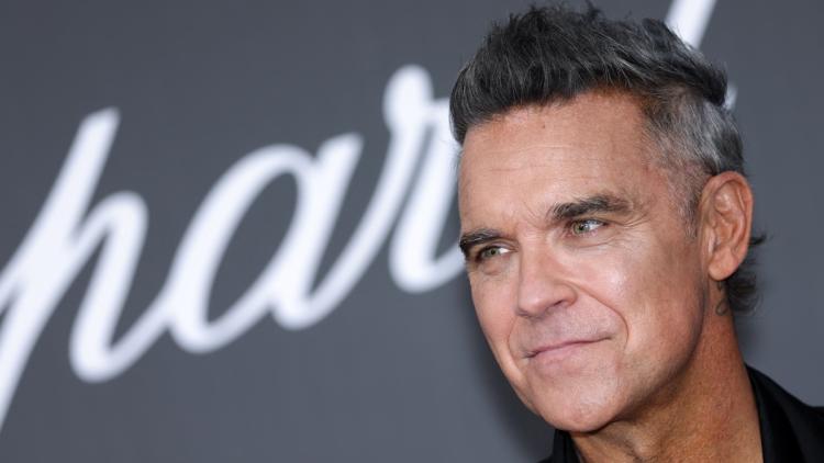69248b14-63e0-4a31-b70c-7030b564665f Robbie Williams : Révélations sur ses troubles neurodéveloppementaux